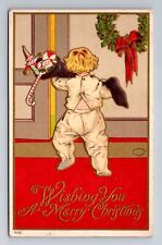 Wishing You A Merry Christmas, Child With Presents Embossed Vintage Postcard picture