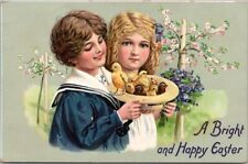 c1910s Tuck's EASTER Greetings Postcard Boy & Girl / Baby Chicks in Straw Hat picture