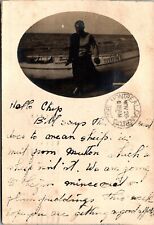 VINTAGE POSTCARD REAL PHOTO RPPC OF J. BRIGGS BESIDE KAYAK MAILED MONTREAL 1907 picture