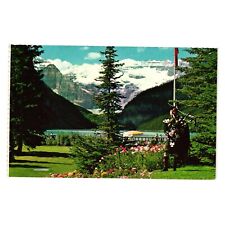 Vintage Postcard Canadian Rockies Lake Louise Highland Bagpipes Mountain Garden picture
