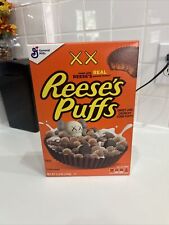 KAWS X REESE'S PUFFS CEREAL 11.5 OZ BOX COLLECTORS EDITION (UNOPENED) picture