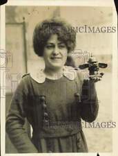 1919 Press Photo Woman Holding Pig Figurine with German Helmet, Versailles picture
