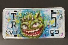 Repurposed vintage license plate monster art picture