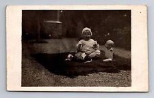 RPPC-Small Child Sobbing, Weird Dismembered Doll, Vintage Postcard picture