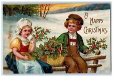 1908 Christmas Boy Girl Holly Berries Winter Snow Embossed Antique Postcard picture