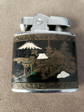 Vintage Firefly Cigarette Lighter. Japanese scenery. Gold, black and white. picture