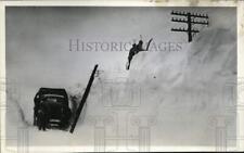 1936 Press Photo Workers climb a snow drift to repair lines near Freeport, IL picture