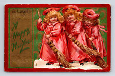 TUCK's Three Girls Sweeping Happy New Year Embossed Postcard picture
