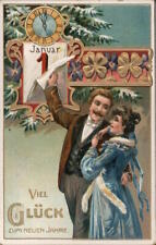 New Year A man with his arm around a woman and removing a page from a calendar s picture