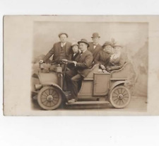 friends posing on a jalopy  c1910  RPPC picture