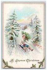 c1910's Christmas Boy Sledding Winter Pine Trees Embossed Antique Postcard picture