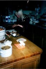Pretty woman in kitchen eating Found Color Photo V0301 picture