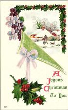 c1915 JOYOUS CHRISTMAS SNOW HOLLY FLORAL TOWN DOG EMBOSSED POSTCARD 41-201 picture