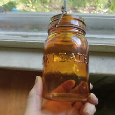 THE LEADER AMBER PINT FRUIT JAR WITH ORIGINAL 1892 CLOSURE SHINY NEAR MINT picture