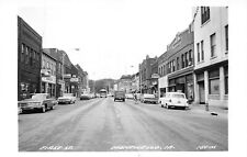 J48/ Monticello Iowa RPPC Postcard c1950s First Street Autos Stores  223 picture