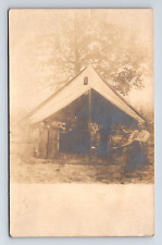 RPPC Man at Military Style Tent Store Vendor? Real Photo Postcard picture