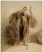 Japan, Portrait of a smoker Japanese farmer with wicker clothing Vintage print, picture