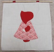 Homemade wall hanging: Sun Bonnet Sue pattern and dowel rod, red bonnet picture