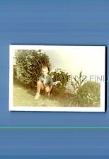 FOUND COLOR PHOTO M+4209 BOY CROUCHING IN BUSHES picture