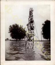 Vintage Found Snapshot Photograph  Human Pyramid Display by the Water's Edge picture