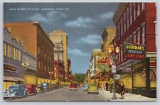 Postcard Dubuque Iowa Main Street at Night Showing Goodmans Opticians Jewelers picture