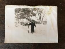 Vintage Photo Happy Young little kid shoveling snow picture