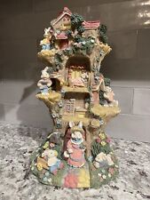 Easter Jubilee Easter Tree House Sculpture Rabbits Colorful picture