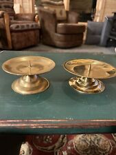 A Pair Of Brass Round Candle Holders picture