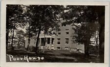 Postcard RPPC Humor Poor House Photo of Large Brick House Man Working in Yard picture