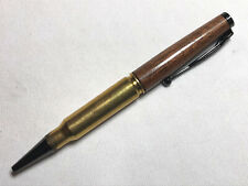 308 caliber bullet pen made with black walnut and a genuine brass casing picture
