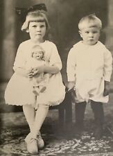 Real photo postcard girl with Antique toy doll next to brother RPPC Vintage picture