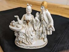 Vtg. ceramic Colonial couple on base. White/gold trim. picture