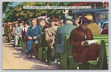 St Petersburg Florida FL, People Sitting on the Famous Green Benches Postcard picture