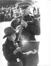 1971 Press Photo Man in Uniform Playing Clarinet Boy Holding Book Soviet Union picture