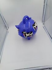 A piggy bank of a dark blue pig with cows painted on it thats about 8 1/2in tall picture