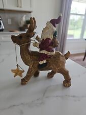 Santa Claus Riding A Reindeer picture