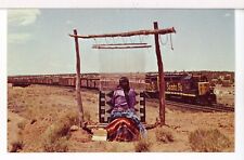 Santa Fe GP35 #1315 Leads Freight Past Native Weaver, Gallup NM Trains Postcard picture