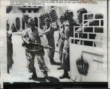 1958 Press Photo Iraqi Soldier Use Rifle to Point to the Late King Faisal Palace picture