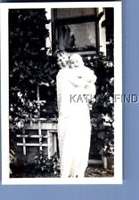 FOUND B&W PHOTO U_5233 PRETTY WOMAN IN DRESS POSED HOLDING BABY picture