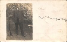 MAN HOLDING RIFLE real photo postcard ANTIQUE ARMED MAN PORTRAIT RPPC c1910 gun picture