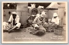 RPPC US Navy Sailors on Ship Making Foot Mats c1910 Real Photo Postcard picture