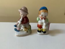 Lot of 2 small Made in Occupied Japan figurines, children playing horns, 2.75
