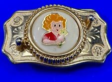 Adorable red headed girl with flower as centerpiece on western belt buckle picture