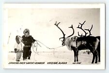 1953 RPPC Looking Over Santa's Reindeer Kotzebue Alaska Christmas Postcard Snow picture