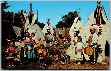 Vtg Indian Village Native American Teepee Headdress Men Women Children Postcard picture