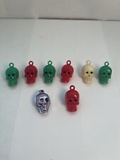 EIGHT VINTAGE CRACKER JACK/ GUMBALL SKULL CHARMS picture