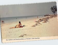 Postcard Sun bathers and beachcombers on Floridas white beaches Florida USA picture