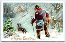 Postcard Merry Christmas, Man in Snow Carrying Hare Dachshund, DB 1908 Emb Tuck picture