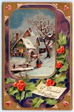 1920 A PEACEFUL CHRISTMAS COTTAGE SNOW SCENE GOLD METALLIC EMBOSSED POSTCARD picture