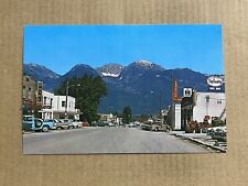 Postcard Ronan MT Street View Old Cars Mission Mountains Signs Chrysler Hotel picture